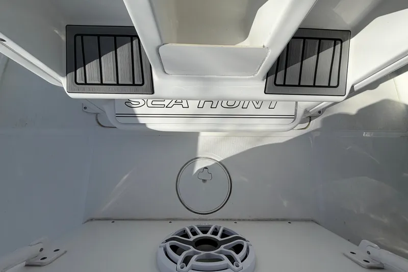 Slide: The Image of Interior view of 2025 Sea Hunt Gamefish 27CB boat, featuring deck details and branding. - 31
