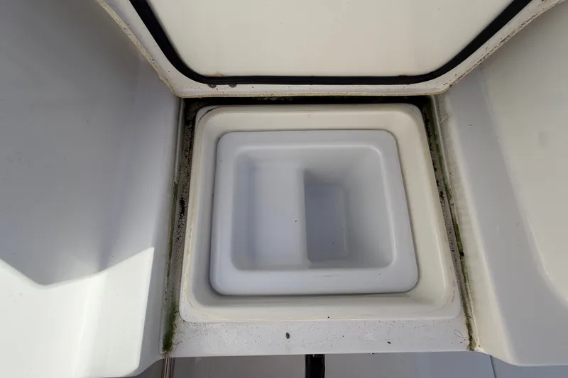 Slide: The Image of Open storage compartment on 2025 Sea Hunt Gamefish 27CB boat. - 68