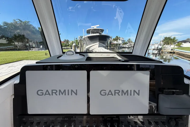 Slide: The Image of Interior view of 2025 Sea Hunt Gamefish 27CB boat with Garmin navigation displays. - 33