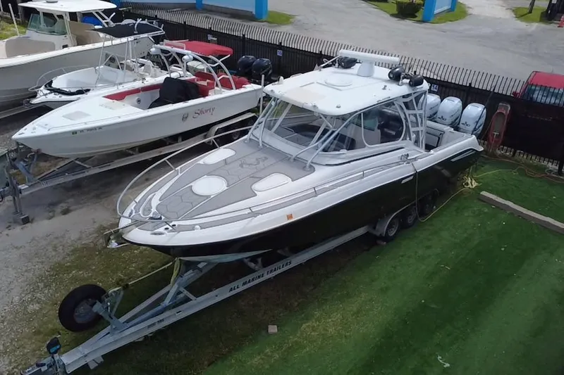 Slide: The Image of 2005 Hydra-Sports 3300 VX boat on trailer, parked on grass. - 18