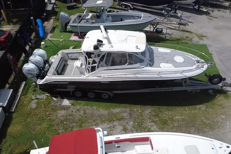 Slide: The Image of 2005 Hydra-Sports 3300 VX boat on trailer, aerial view, parked in a marina. - 21