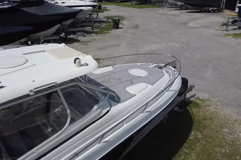 Slide: The Image of 2005 Hydra-Sports 3300 VX boat on trailer in outdoor storage area. - 3