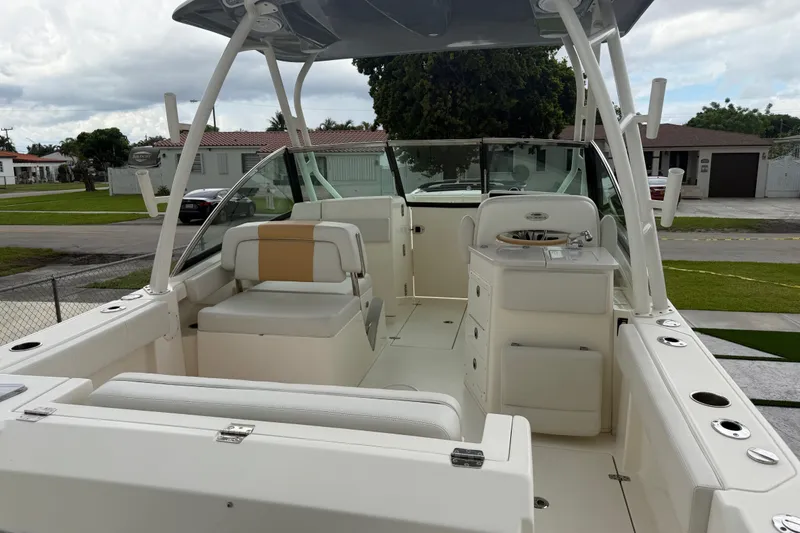 Slide: The Image of 2021 Cobia 240 Dual Console boat interior with seating and helm station. - 27