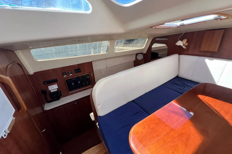 Slide: The Image of Interior of 2013 Gemini Legacy 35 sailboat with seating and control panel. - 90
