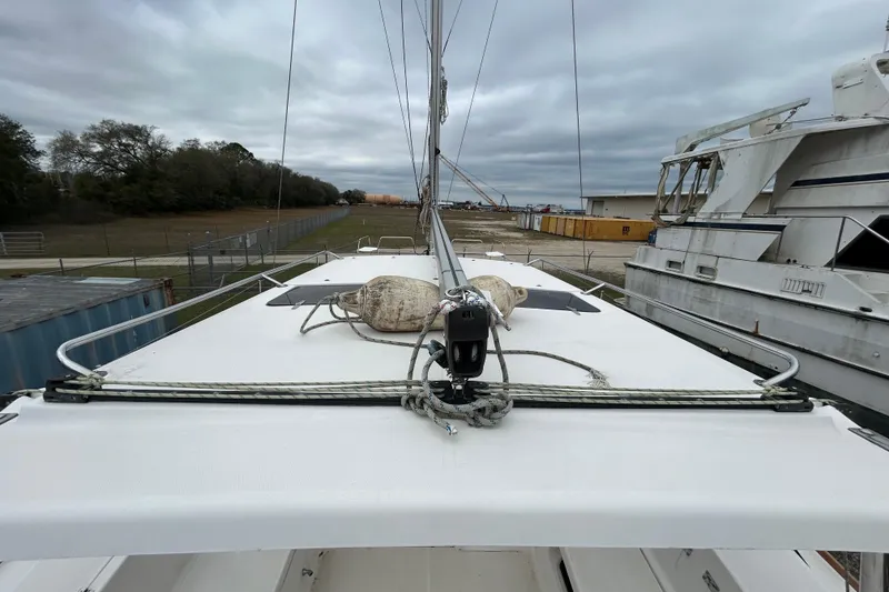 Slide: The Image of 2013 Gemini Legacy 35 sailboat deck with ropes and equipment, overcast sky background. - 62