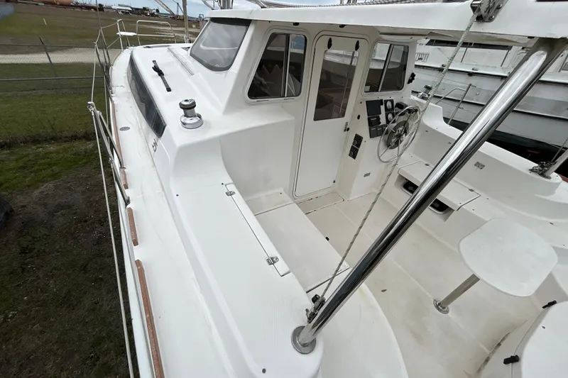 Slide: The Image of 2013 Gemini Legacy 35 catamaran with spacious cockpit and modern steering wheel. - 30