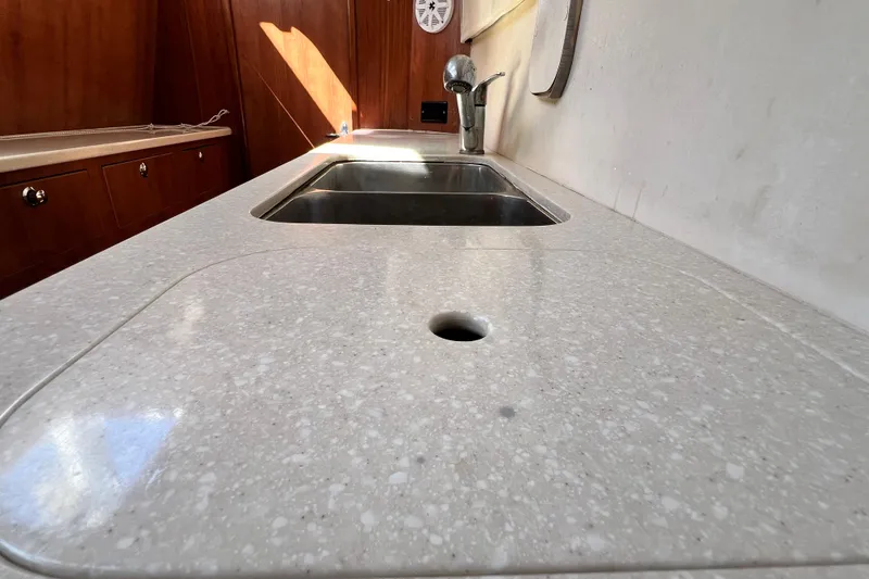 Slide: The Image of 2013 Gemini Legacy 35 yacht kitchen with sleek countertop and stainless steel sink. - 104