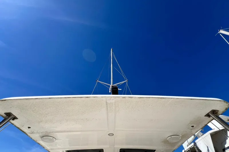 Slide: The Image of 2013 Gemini Legacy 35 catamaran under clear blue sky, viewed from below. - 65