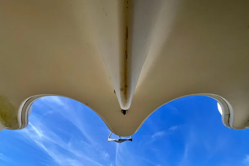 Slide: The Image of Underneath view of 2013 Gemini Legacy 35 catamaran against a clear blue sky. - 148