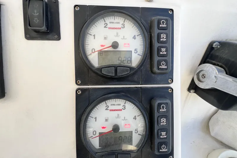 Slide: The Image of Control panel of 2013 Gemini Legacy 35 with Yanmar engine gauges and buttons. - 70