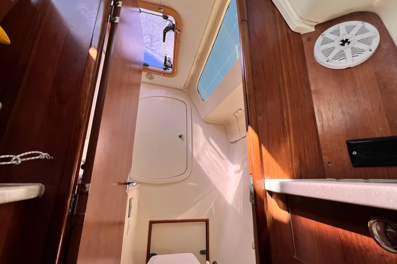 Slide: The Image of Interior view of 2013 Gemini Legacy 35 sailboat with wooden finishes and natural light. - 106