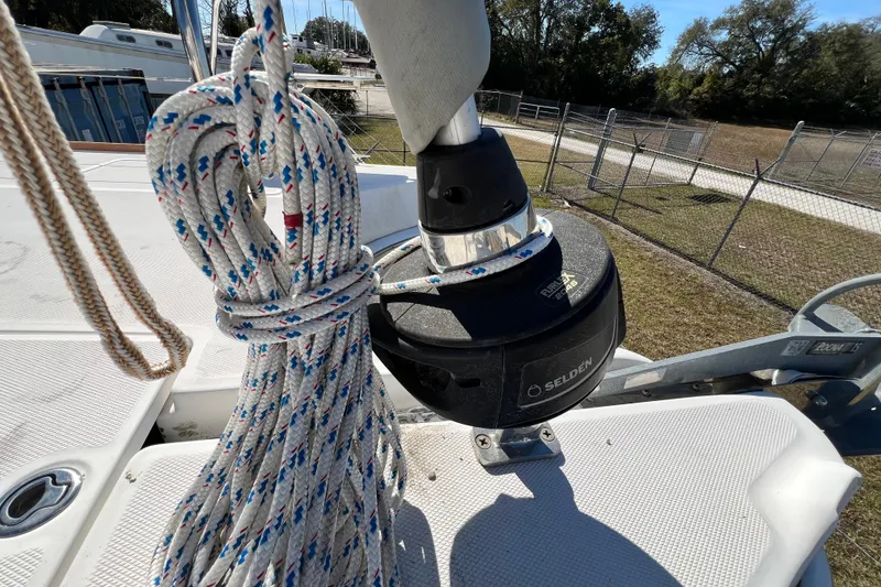 Slide: The Image of Rope and furler on 2013 Gemini Legacy 35 sailboat deck, with outdoor background. - 164