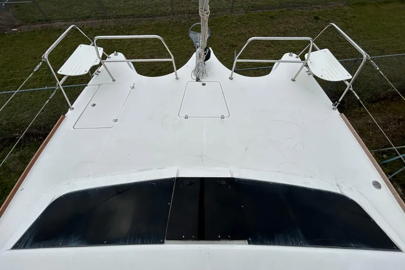 Slide: The Image of Deck view of a 2013 Gemini Legacy 35 catamaran, featuring seating and railing. - 38
