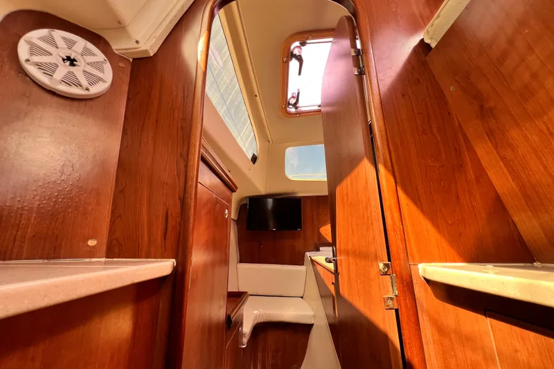 Slide: The Image of Interior of 2013 Gemini Legacy 35 sailboat with wood finish and natural light. - 124
