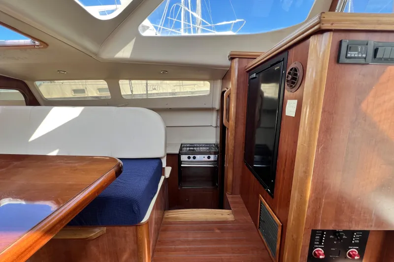 Slide: The Image of Interior of 2013 Gemini Legacy 35 yacht with wood finish and seating area. - 93