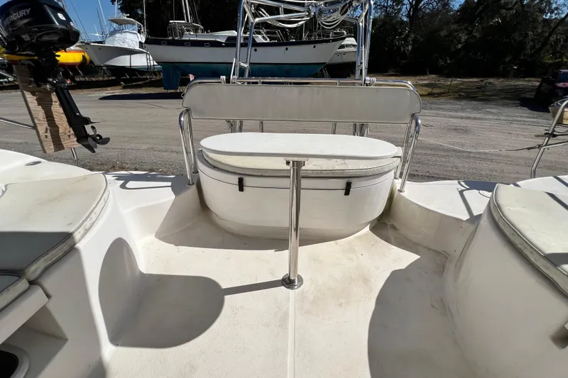 Slide: The Image of 2013 Gemini Legacy 35 boat cockpit with seating and outboard motor. - 74