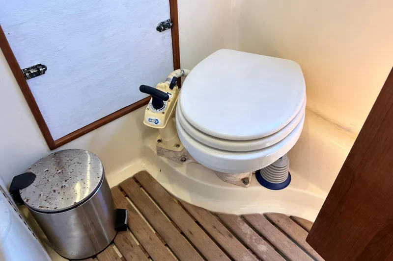 Slide: The Image of Boat bathroom with toilet and trash can, Gemini Legacy 35, 2013 model. - 122
