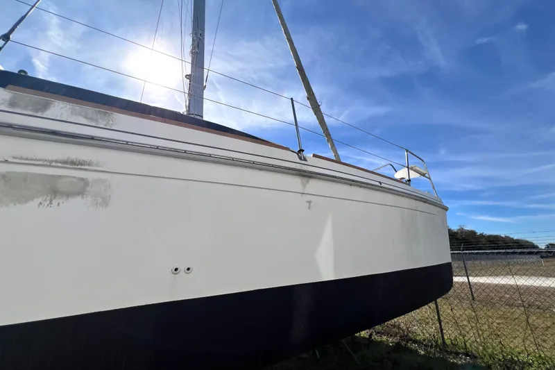 Slide: The Image of Sailboat Gemini Legacy 35, 2013 model, docked under clear blue sky. - 22