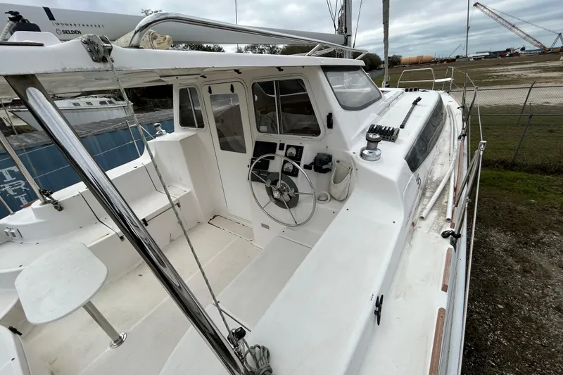 Slide: The Image of 2013 Gemini Legacy 35 sailboat cockpit with steering wheel and navigation controls. - 27