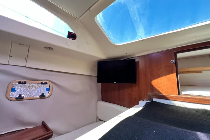 Slide: The Image of Interior of 2013 Gemini Legacy 35 sailboat with skylight and mounted TV. - 130