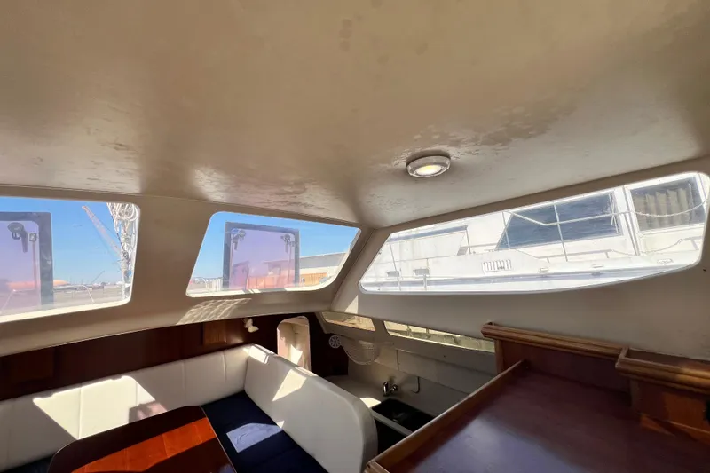Slide: The Image of Interior of 2013 Gemini Legacy 35 sailboat with large windows and seating area. - 91