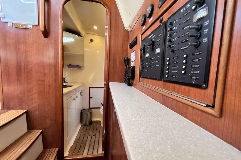 Slide: The Image of Interior of 2013 Gemini Legacy 35 yacht showing control panel and bathroom. - 117