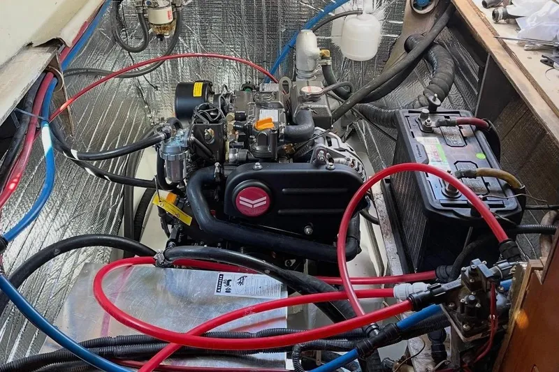 Slide: The Image of Engine compartment of a 2013 Gemini Legacy 35 sailboat with visible wiring and equipment. - 139