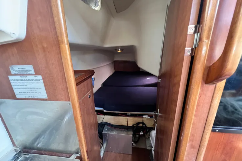 Slide: The Image of Cozy cabin interior of 2013 Gemini Legacy 35 sailboat with wooden finish. - 98
