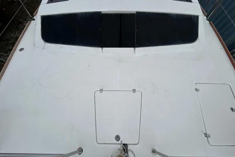 Slide: The Image of Top view of a 2013 Gemini Legacy 35 catamaran deck with hatches and windows. - 50