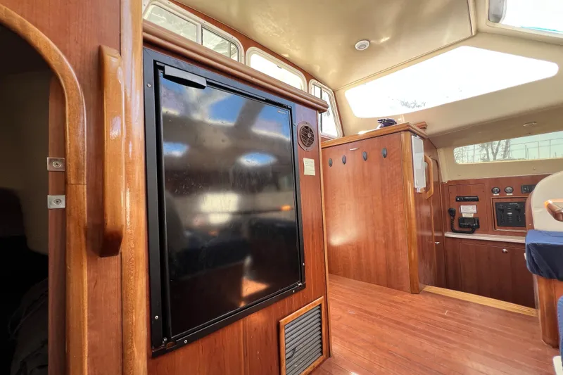 Slide: The Image of Interior of 2013 Gemini Legacy 35 sailboat with wooden cabinetry and skylights. - 112