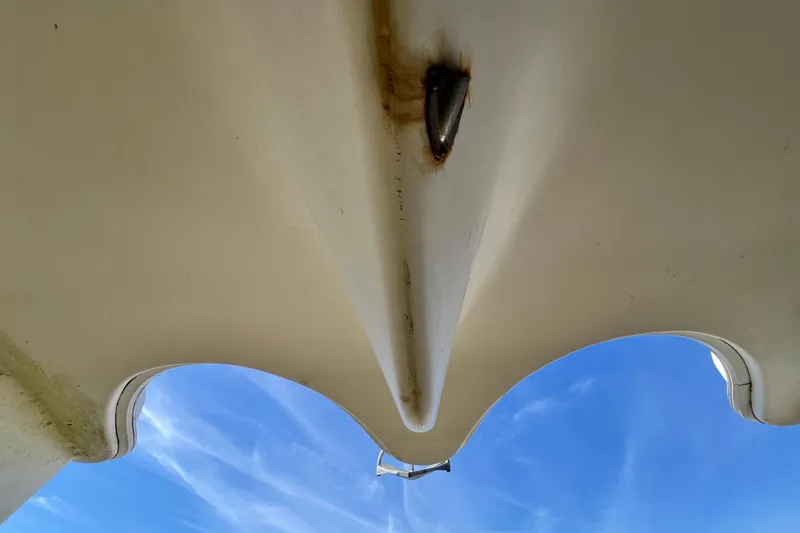 Slide: The Image of Underside view of 2013 Gemini Legacy 35 catamaran against a clear blue sky. - 146