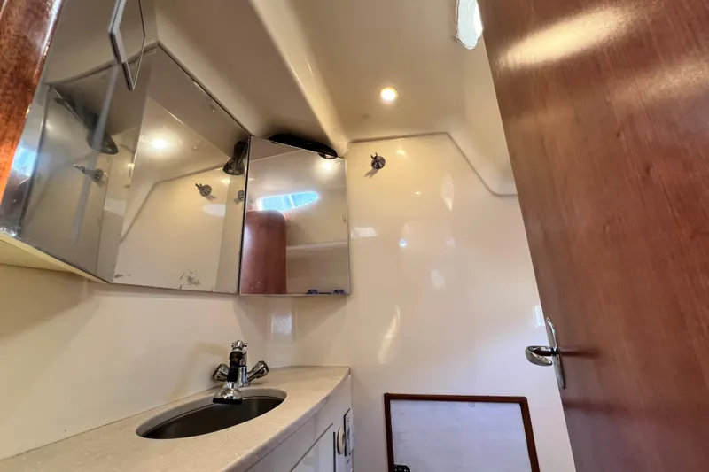 Slide: The Image of Bathroom interior of 2013 Gemini Legacy 35 yacht with sink and mirrored cabinets. - 120