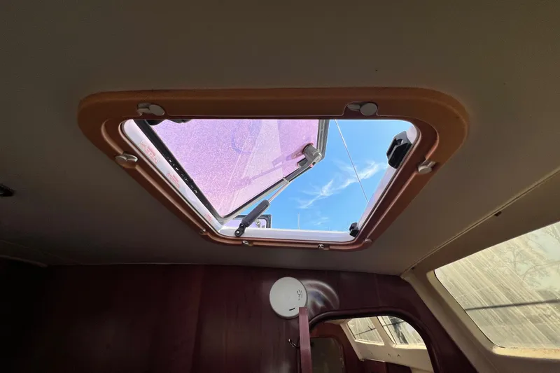 Slide: The Image of Open hatch on 2013 Gemini Legacy 35 sailboat, revealing blue sky. - 132