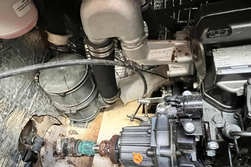 Slide: The Image of Engine compartment of a 2013 Gemini Legacy 35, featuring Yanmar components and plumbing. - 138