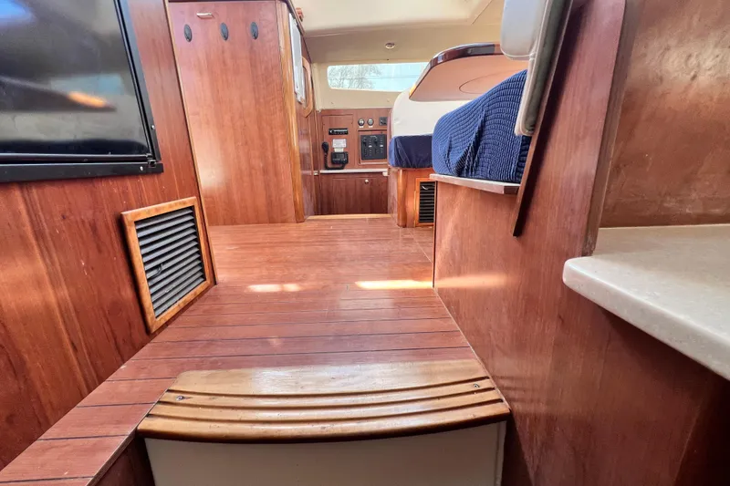 Slide: The Image of Interior of 2013 Gemini Legacy 35 boat with wooden flooring and cabinetry. - 111