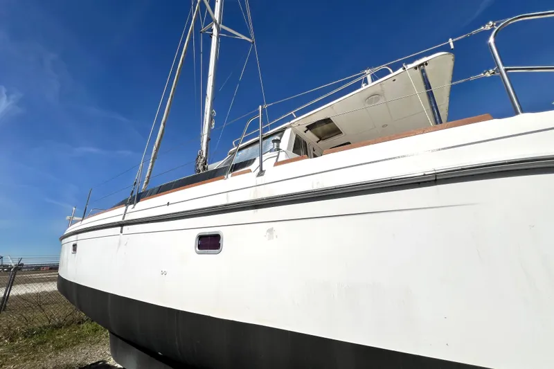 Slide: The Image of 2013 Gemini Legacy 35 sailboat on land under clear blue sky. - 14