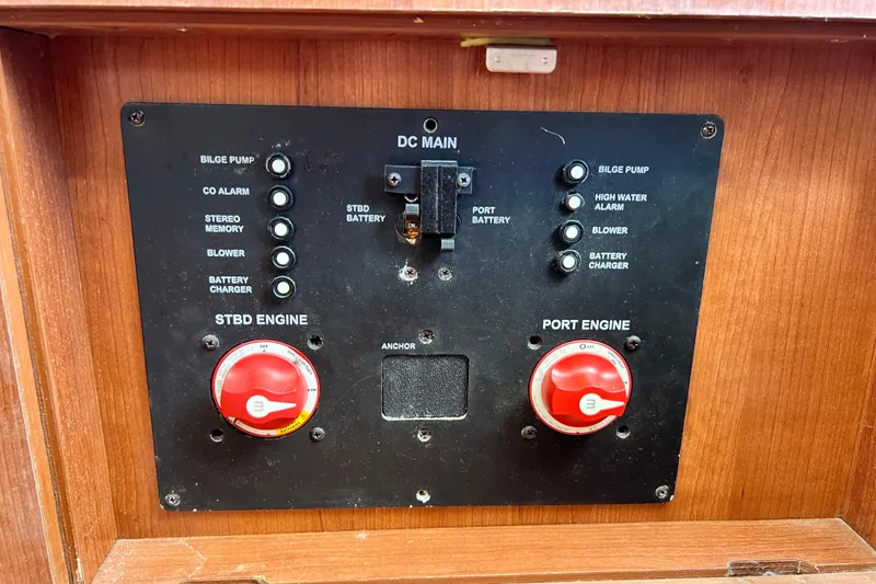 Slide: The Image of Control panel of a 2013 Gemini Legacy 35 boat with engine and battery switches. - 168