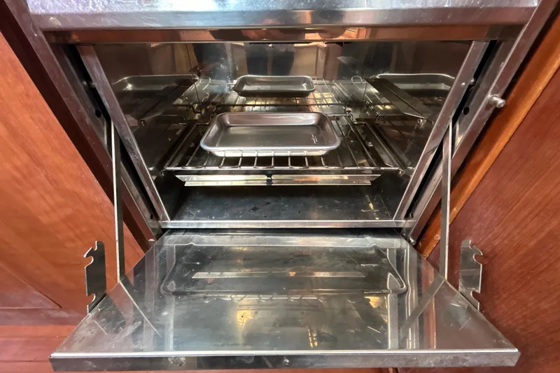 Slide: The Image of Open Gemini Legacy 35 oven, 2013 model, with metal trays inside. - 96