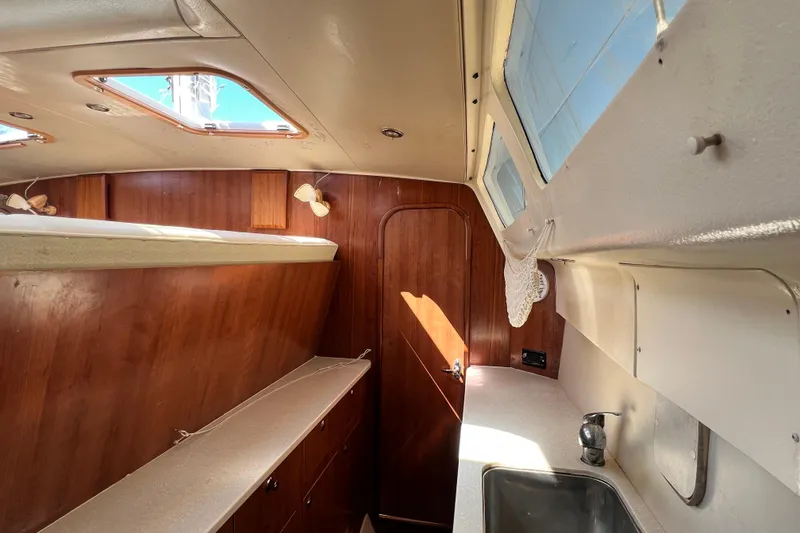Slide: The Image of Interior of 2013 Gemini Legacy 35 sailboat with wood finish and natural light. - 102
