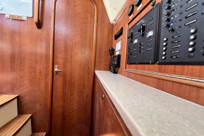 Slide: The Image of Interior of 2013 Gemini Legacy 35 yacht with control panels and wooden finish. - 116