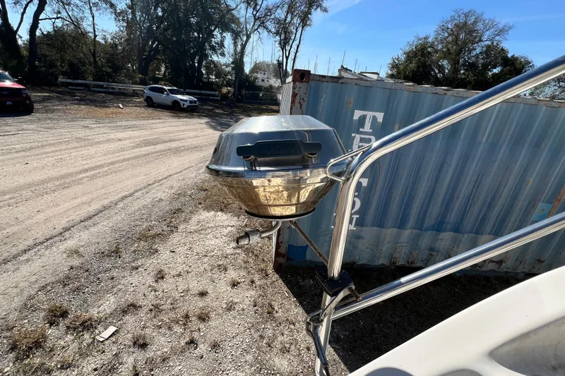 Slide: The Image of Outdoor grill mounted on a 2013 Gemini Legacy 35 boat, near a shipping container. - 76
