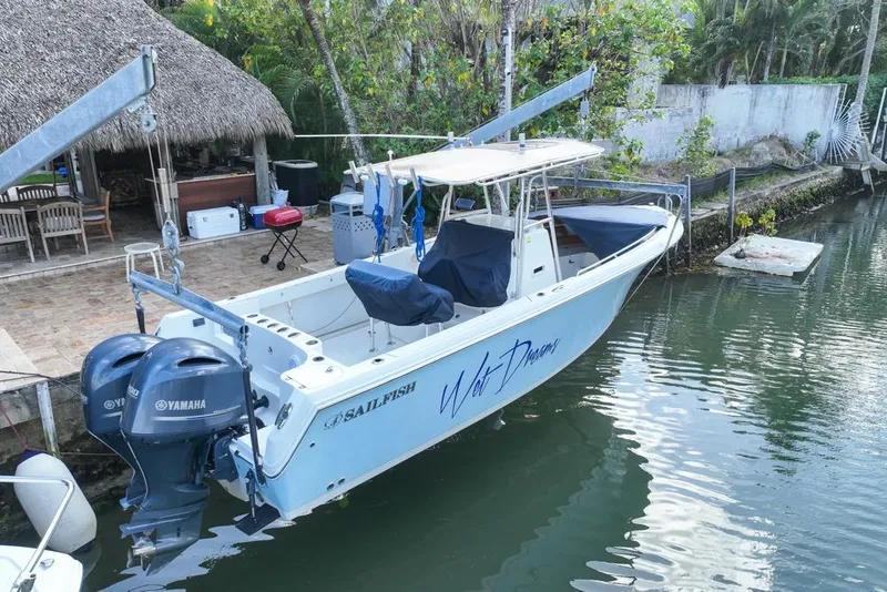 Slide: The Image of 2005 Sailfish 2660 CC boat docked with dual Yamaha engines. - 6