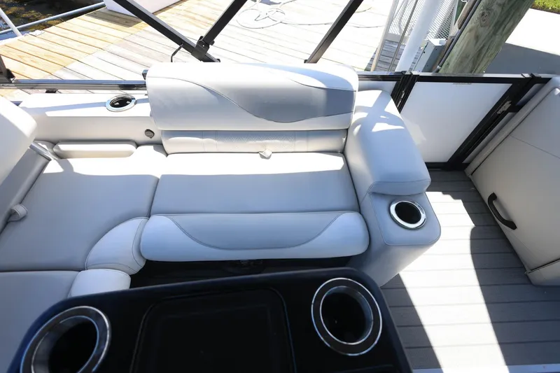 Slide: The Image of Luxurious seating on 2025 Tahoe Pontoon LTZ 23 with cup holders and sleek design. - 15