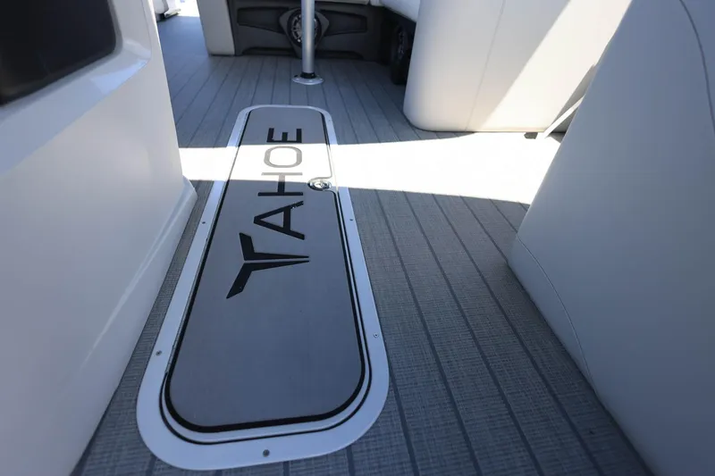 Slide: The Image of 2025 Tahoe Pontoon LTZ 23 interior with branded flooring and sleek design. - 19