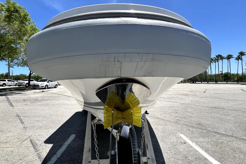 Slide: The Image of 2013 Novurania Chase 23 boat on trailer in sunny parking lot. - 19