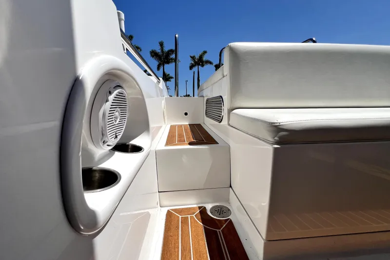Slide: The Image of Interior view of 2013 Novurania Chase 23 boat with wooden flooring and seating. - 79