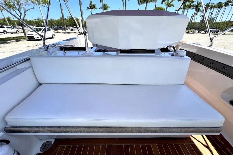 Slide: The Image of 2013 Novurania Chase 23 boat interior with white seating and teak flooring. - 61