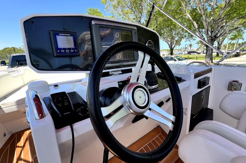 Slide: The Image of Steering console of 2013 Novurania Chase 23 boat with modern controls and navigation system. - 31