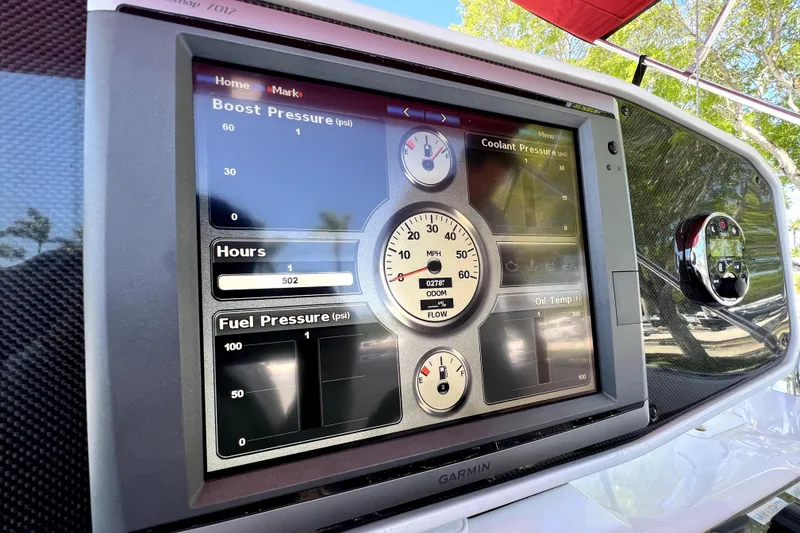 Slide: The Image of Dashboard display of a 2013 Novurania Chase 23 showing various engine metrics. - 39