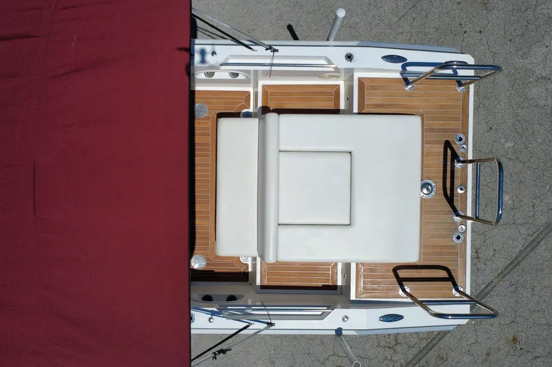 Slide: The Image of Overhead view of 2013 Novurania Chase 23 boat with wooden deck and seating. - 28